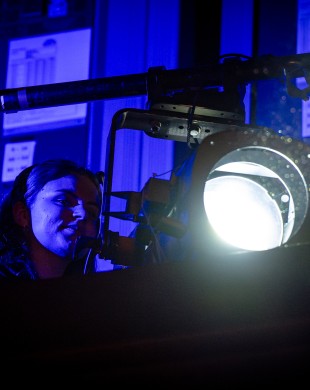 Student with lighting on set