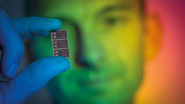 Man holding up multispectral’ light sensor