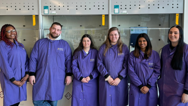 6 staff members in lab coats