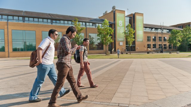 Prospective students walking across campus