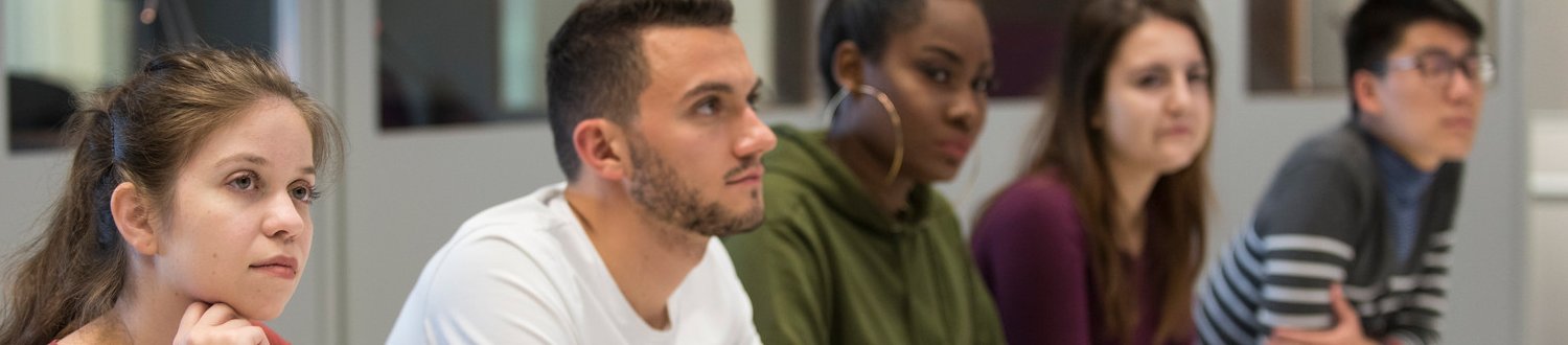 a row of attentive students in class