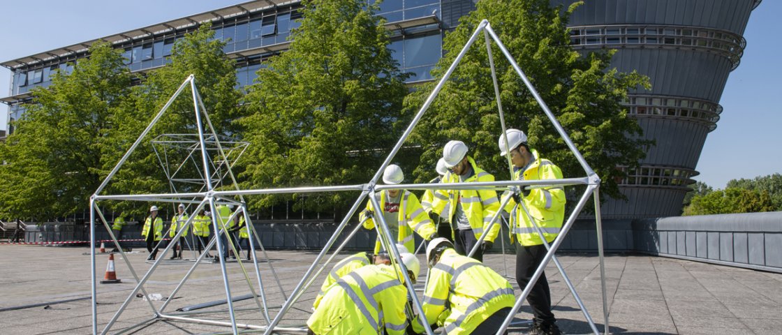 Students building a structure as part of the DAD project