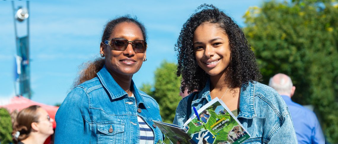 Two women smiling at camera