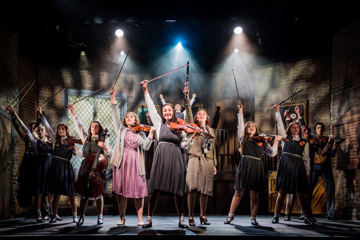 Students performing on stage