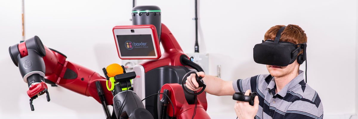 Student making a robot move using a VR headset