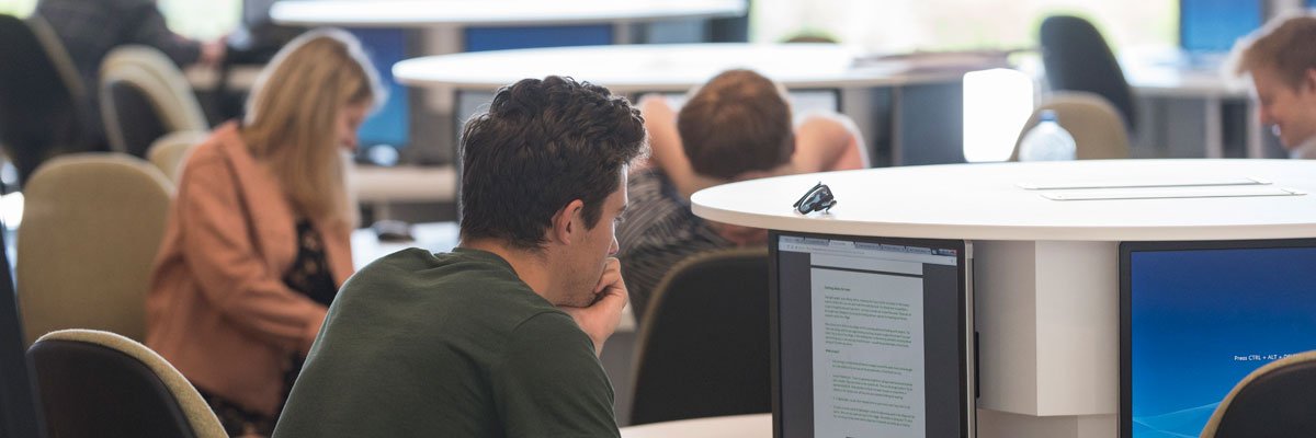 Students working in the computing area within the Innovation for Health building