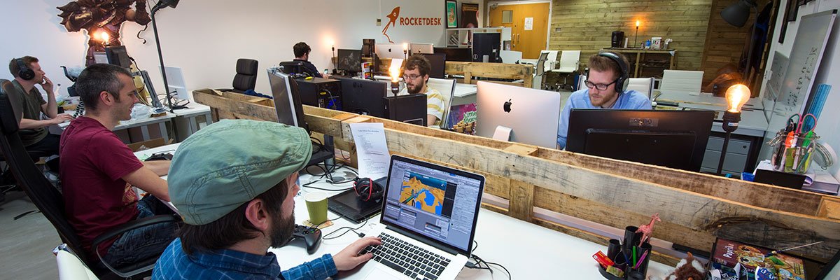 Team members of Rocketdesk in their office in the Surrey Research Park