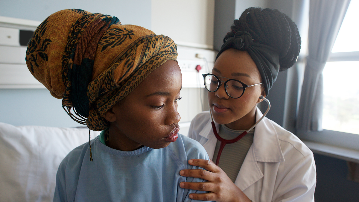 doctor examines a patient using a stethoscope