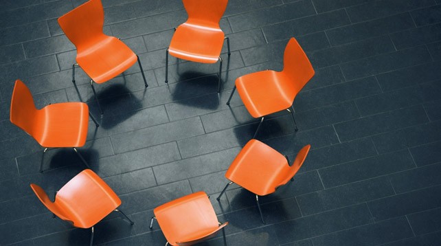 Orange chairs facing in a circle