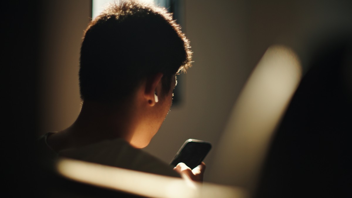 A person scrolls on their phone