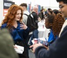 Careers fair chatting woman and students