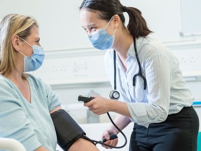 Student taking blood pressure