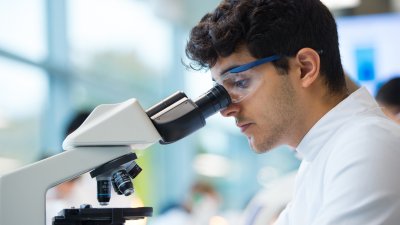 Student using microscope