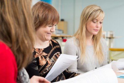 A group read papers together