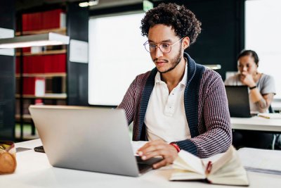 Man sat working on laptop