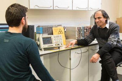 Professor and student sat together in lab