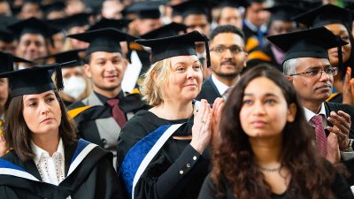 Students clapping at graduation