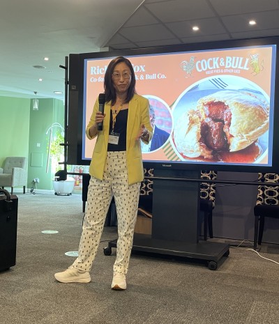 Dr Yanfei Hu speaking at plant-based tasting event held at the University of Surrey