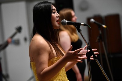 Singer performing at University of Surrey's Music and Sound Recording (Tonmeister) 55th anniversary, September 2025