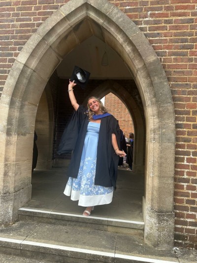 University of Surrey Occupational and Organisational Psychology student Amelia in her graduation gown at Guildford Cathedral