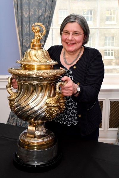 University of Surrey's Professor Sabine Braun holding the Chartered Institute of Linguists' CIOL Threlford Cup, June 2026