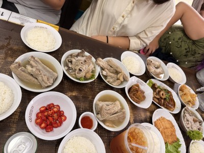 An array of Singaporean food dishes on a table.