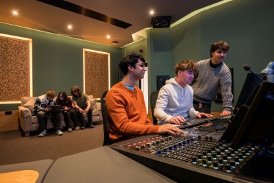 University of Surrey students operating board in immersive mix studio