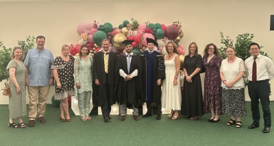 Image showing University of Surrey Law student at graduation ceremony reception with his teachers
