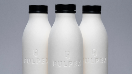 Three Pulpex paper fibre bottles displayed on a grey background