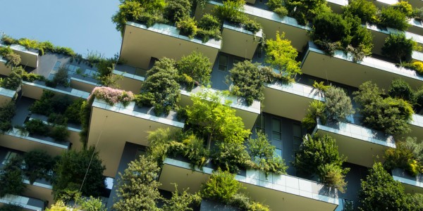 Apartment building with vegetation growing on outside