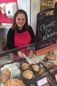 Lucy working in a cafe