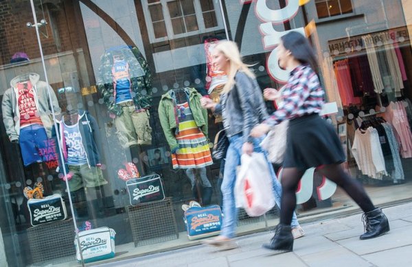 Shoppers in Guildford High Street with bags
