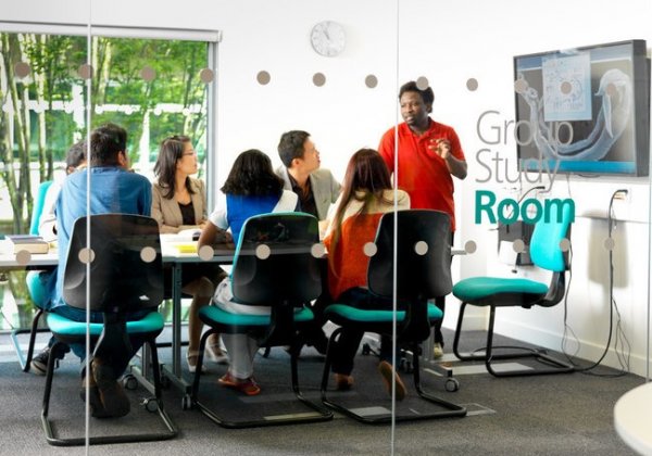 Students working on a project in the library