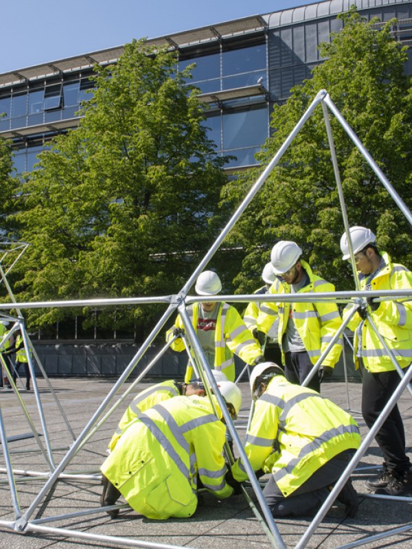 Students building a structure as part of the DAD project