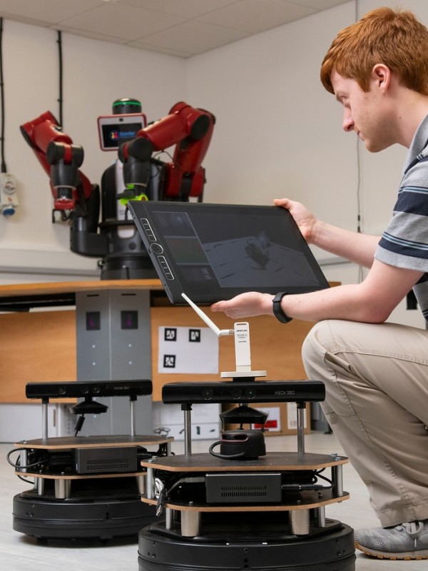 Electrical and electronic engineering student in robotics lab