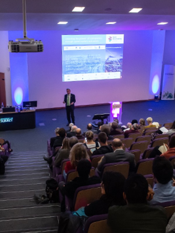 Audience in lecture theatre listening to Steve Waygood