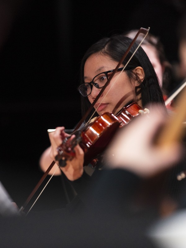 Music student playing violin