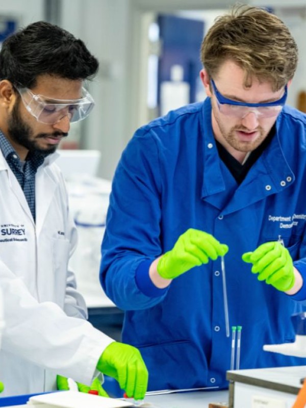 Pharmaceutical Sciences students at work in the lab with a technician