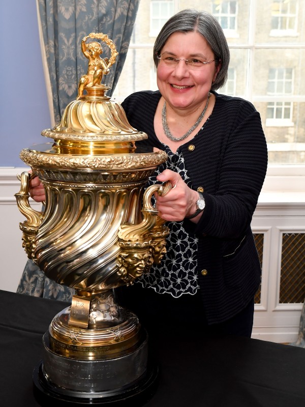 University of Surrey's Professor Sabine Braun holding the Chartered Institute of Linguists' CIOL Threlford Cup, June 2026