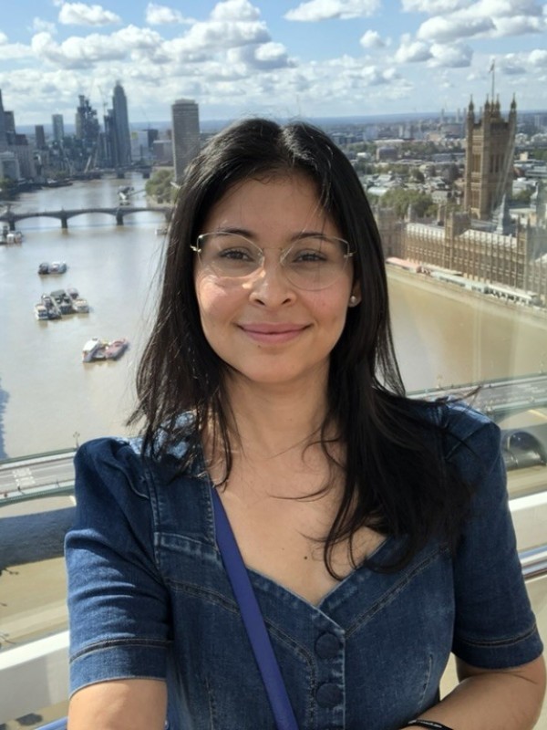 Larissa takes a selfie in the London Eye with the Thames visible behind her.