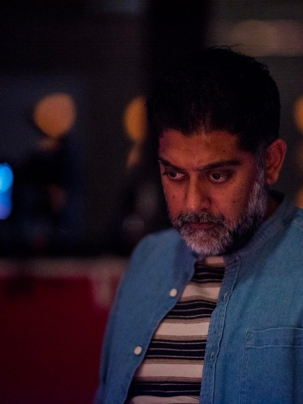 A director looking down during a tech rehearsal