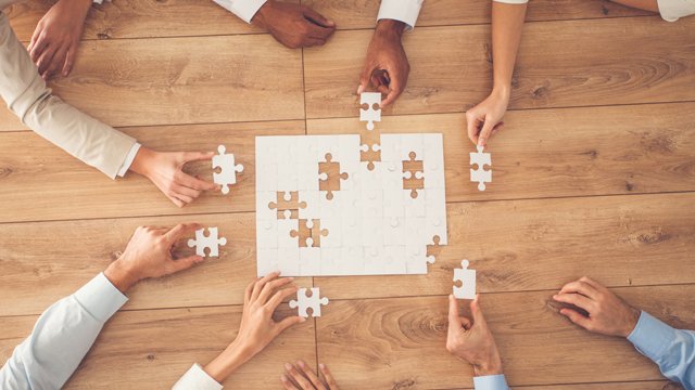 People putting a puzzle together