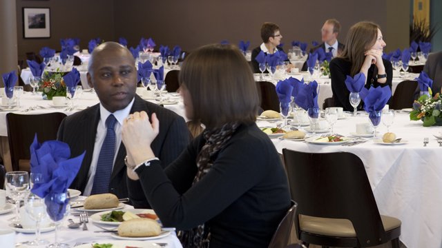 People sat together at dinner tables