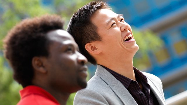 Two male students laughing