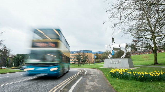 A bus driving through campus