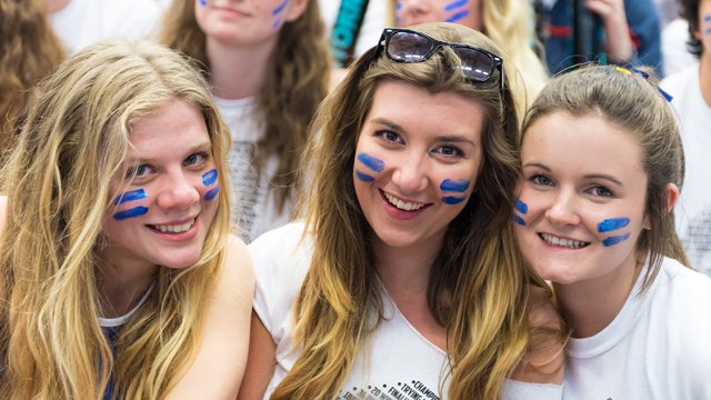 Three female students smiling