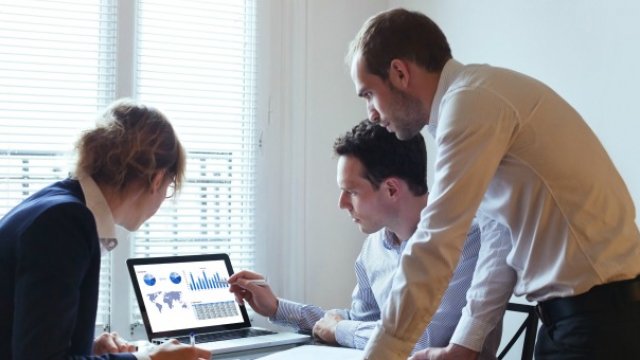 People looking at a laptop