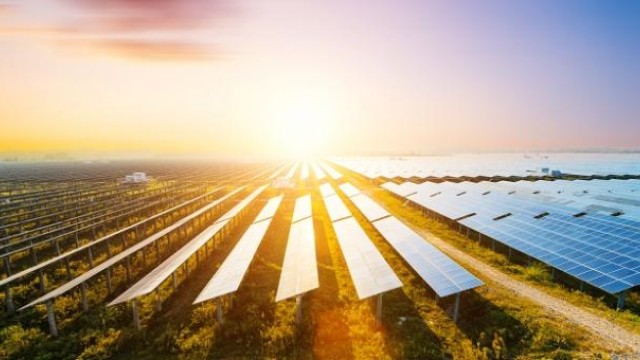 Solar panels under sunset