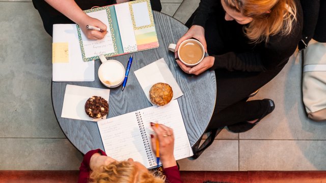 Group sat working in a cafe