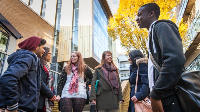 People standing outside the University of Surrey Library